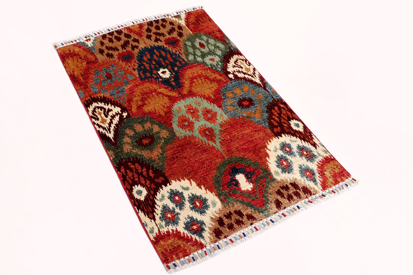 IKAT HANDMADE WOOL AREA RUG   2’8” X 4’